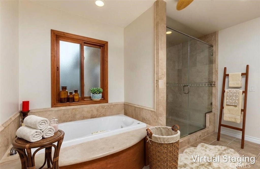 Spa-inspired bath at 116 Termino with soaking tub and glass shower (virtually staged)