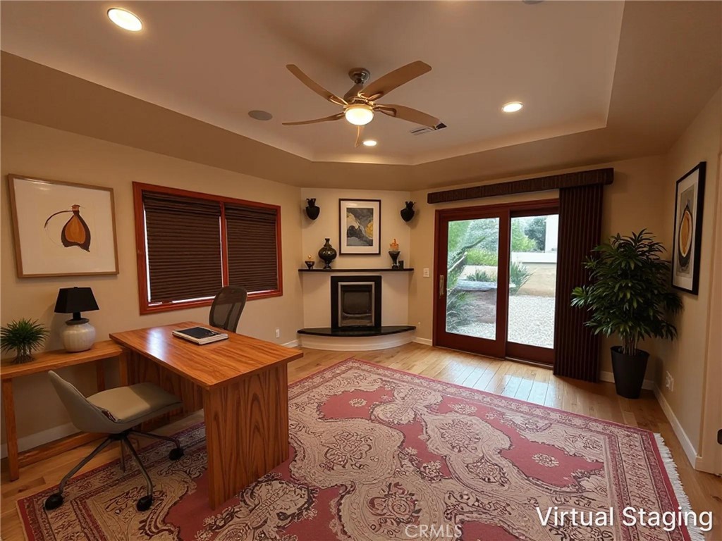 Downstairs junior suite at 116 Termino with fireplace, shown as home office (virtually staged)